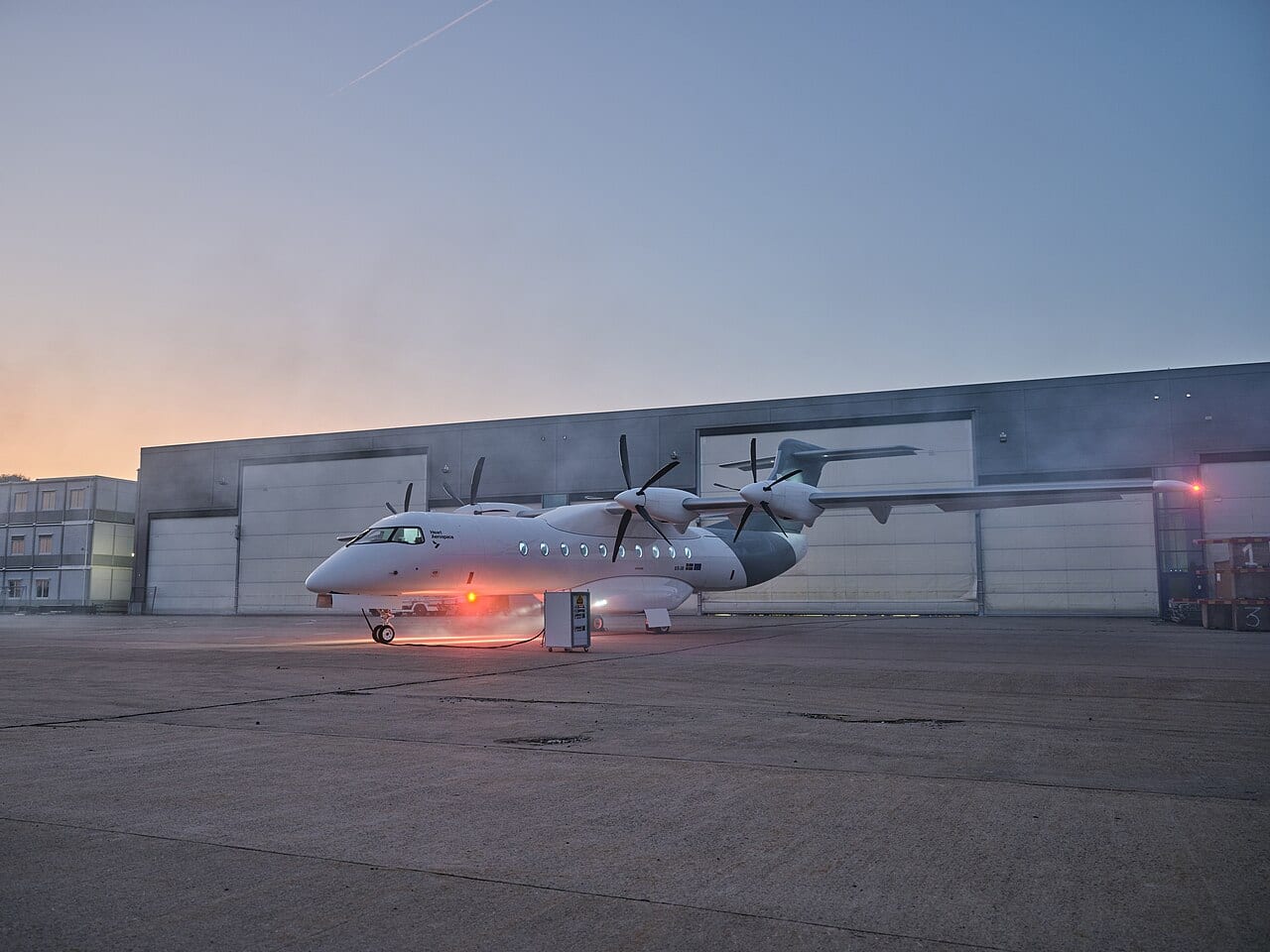 The Heart Aerospace X1 prototype on the apron at dawn during its public rollout, ahead of its first flight.