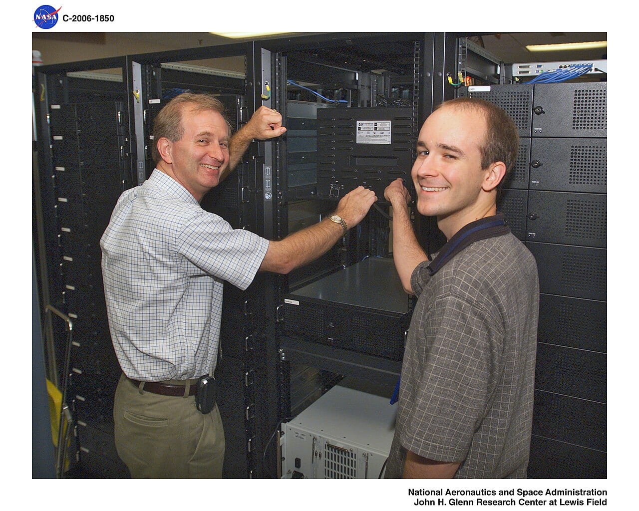 Rows of server racks and network cabling in a NASA computing facility.